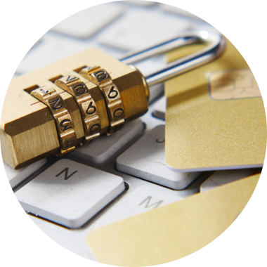 A padlock and bank cards on a keyboard
