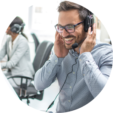 Man laughing with headphones while having a call