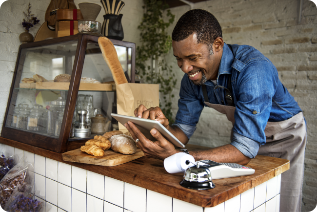 Coffee shop owner ordering goods for his business online